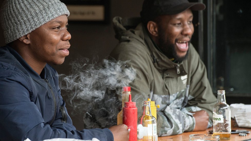 Men drinking and smoking in South Africa - August 2020